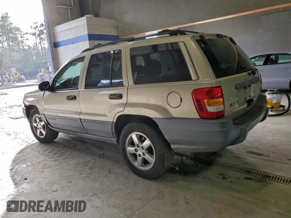 ✅ 2001 Jeep Grand Cherokee Laredo • VIN: 1J4GX48S31C504494 • Лот: 94961115. Опубликован ранее на Copart с пробегом Не указан. Бесплатный доступ к архиву аукционных продаж из США и подробный отчёт об истории автомобиля на DreamBid. Изображение 2.