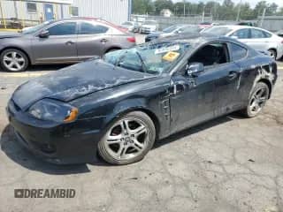2006 Hyundai Tiburon GT с VIN KMHHN65F76U203646, выставлен на аукционе Copart как лот 65899555 с пробегом Не указан миль и Списание • Salvage title. История ставок и продаж доступна на DreamBid. Изображение 1.