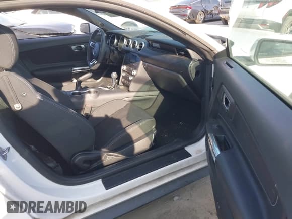 ✅ 2021 Ford Mustang EcoBoost • VIN: 1FA6P8TH7M5140566 • Lot: 43201041. Listed on IAAI with 27,000 mi. Free auction sales archive from the USA and detailed vehicle history report at DreamBid. Image 5.