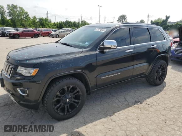 ✅ 2014 Jeep Grand Cherokee Overland • VIN: 1C4RJFCG6EC547604 • Lot: 55824944. Listed on Copart with 128,330 mi. Free auction sales archive from the USA and detailed vehicle history report at DreamBid. Image 1.
