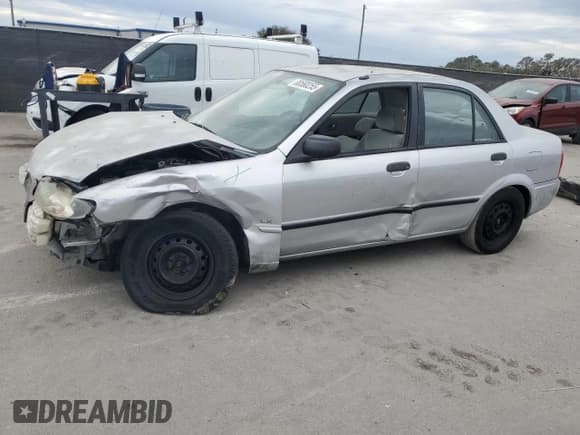 ✅ 2001 Mazda Protege DX • VIN: JM1BJ222310425181 • Lot: 88560255. Wystawiony na Copart z przebiegiem 201 942 mil. Bezpłatny archiwum sprzedaży aukcyjnych z USA i szczegółowy raport historii pojazdu na DreamBid. Zdjęcie 1.
