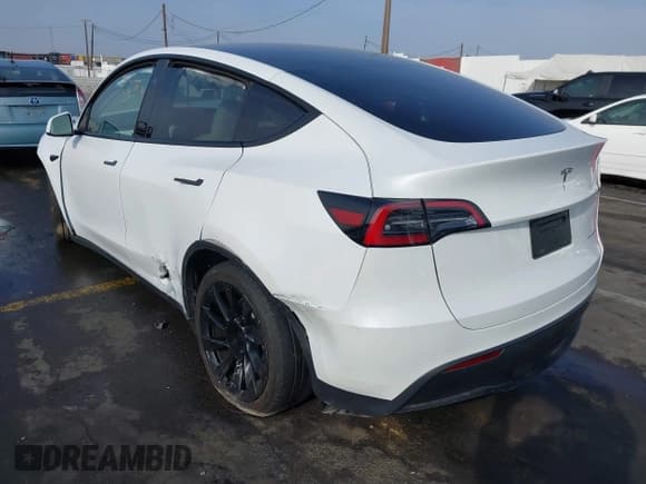 ✅ 2023 Tesla Model Y Long Range • VIN: 7SAYGDEE3PF900030 • Lot: 41147192. Listed on IAAI with 13,903 mi. Free auction sales archive from the USA and detailed vehicle history report at DreamBid. Image 3.