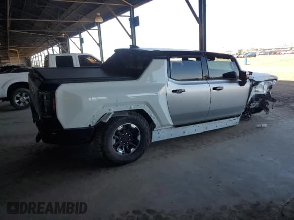 ✅ 2022 GMC HUMMER EV • VIN: 1GT40FDA9NU100685 • Lot: 62721205. Wystawiony na Copart z przebiegiem Nie podano. Bezpłatny archiwum sprzedaży aukcyjnych z USA i szczegółowy raport historii pojazdu na DreamBid. Zdjęcie 3.