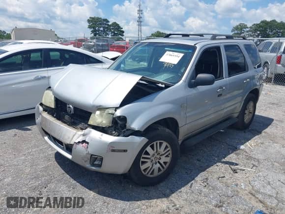 2005 Mercury Mariner Luxury z VIN 4M2YU561X5DJ09502, wystawiony jako IAAI lot #37069354 z przebiegiem Nie podano mil oraz . Historia ofert i sprzedaży dostępna na DreamBid. Obrazek 2.