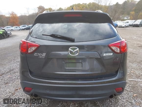 ✅ 2015 Mazda CX-5 Grand Touring • VIN: JM3KE4DY8F0461450 • Lot: 43599095. Listed on IAAI with 137,866 mi. Free auction sales archive from the USA and detailed vehicle history report at DreamBid. Image 16.