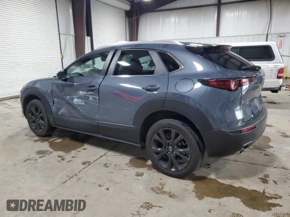 ✅ 2022 Mazda CX-30 S Carbon Edition • VIN: 3MVDMBCL5NM442752 • Лот: 89632795. Опубликован ранее на Copart с пробегом 24 355 миль. Бесплатный доступ к архиву аукционных продаж из США и подробный отчёт об истории автомобиля на DreamBid. Изображение 2.
