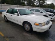 ✅ 1999 Ford Crown Victoria • VIN: 2FAFP73W8XX150079 • Lot: 78923624. Listed on Copart with 128,510 mi. Free auction sales archive from the USA and detailed vehicle history report at DreamBid. Image 4.