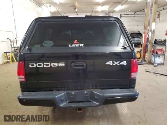 2002 Dodge Dakota Sport z VIN 1B7GG32N92S563589, wystawiony jako Copart lot #79580194 z przebiegiem 110 736 mil mil oraz Czysty tytuł • Clean title. Historia ofert i sprzedaży dostępna na DreamBid. Obrazek 6.