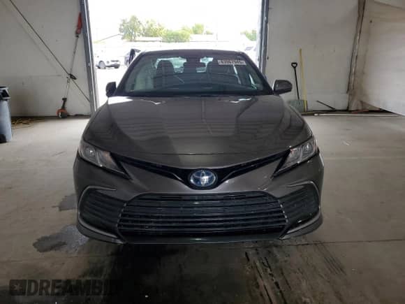 2022 Toyota Camry Hybrid LE с VIN 4T1C31AK6NU575970, выставлен на аукционе Copart как лот 83967945 с пробегом 47 124 миль миль и Списание • Salvage title. История ставок и продаж доступна на DreamBid. Изображение 5.