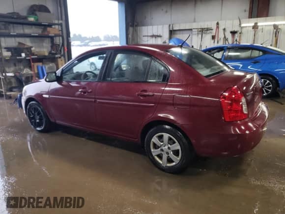 2007 Hyundai Accent GLS z VIN KMHCN46C07U117177, wystawiony jako Copart lot #80696604 z przebiegiem 161 962 mil mil oraz Szkoda całkowita • Salvage title. Historia ofert i sprzedaży dostępna na DreamBid. Obrazek 2.