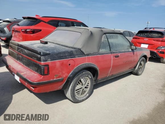 ✅ 1986 Pontiac Sunbird GT • VIN: 1G2JU67J9G7570420 • Лот: 75542874. Опубликован ранее на Copart с пробегом Не указан. Бесплатный доступ к архиву аукционных продаж из США и подробный отчёт об истории автомобиля на DreamBid. Изображение 3.
