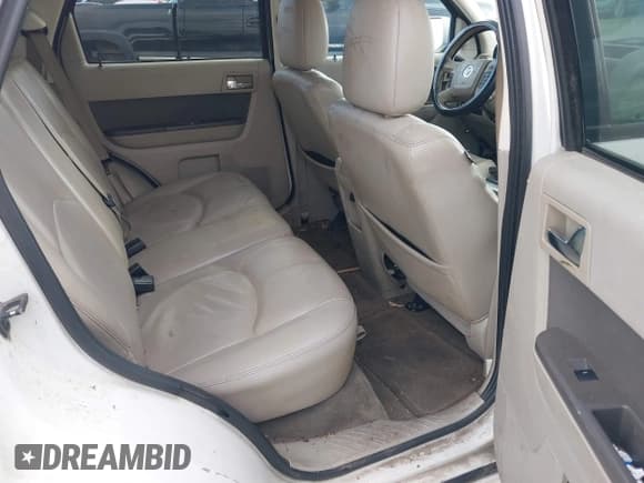 ✅ 2009 Mercury Mariner Premier • VIN: 4M2CU87G69KJ08671 • Lot: 41243011. Wystawiony na IAAI z przebiegiem 247 168 mil. Bezpłatny archiwum sprzedaży aukcyjnych z USA i szczegółowy raport historii pojazdu na DreamBid. Zdjęcie 8.