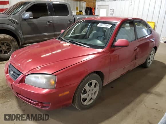 2004 Hyundai Elantra GLS with VIN KMHDN46D14U711429, listed as a Copart auction lot 85075885 with 92,027 mi miles and Salvage title. Bid and sale history available at DreamBid. Image 1.