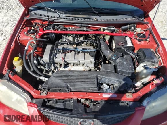 ✅ 2002 Mazda Protege • VIN: JM1BJ245021482277 • Лот: 65128655. Опубликован ранее на Copart с пробегом 256 093 миль. Бесплатный доступ к архиву аукционных продаж из США и подробный отчёт об истории автомобиля на DreamBid. Изображение 11.