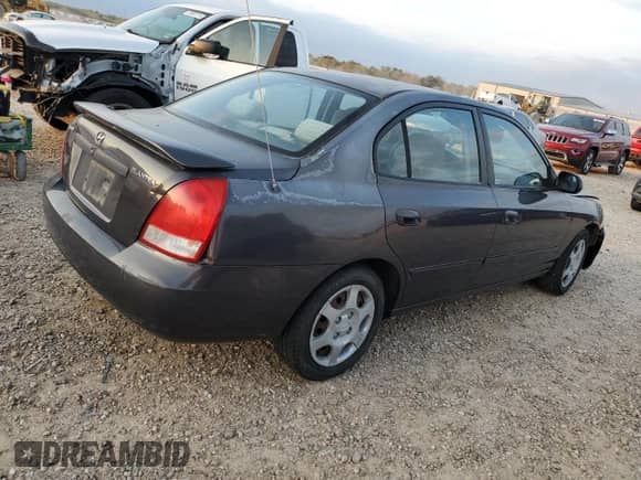 2003 Hyundai Elantra GLS z VIN KMHDN45D53U572664, wystawiony jako Copart lot #82387214 z przebiegiem Nie podano mil oraz Szkoda całkowita • Salvage title. Historia ofert i sprzedaży dostępna na DreamBid. Obrazek 3.