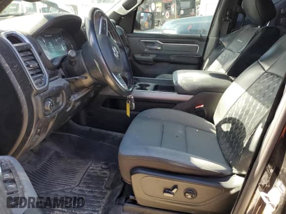 2023 Ram 1500 Lone Star with VIN 1C6RREMT8PN565793, listed as a Copart auction lot 77084184 with 18,825 mi miles and Salvage title. Bid and sale history available at DreamBid. Image 7.