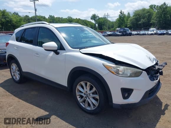 ✅ 2014 Mazda CX-5 Grand Touring • VIN: JM3KE4DY3E0351047 • Lot: 42802433. Wystawiony na IAAI z przebiegiem 61 544 mil. Bezpłatny archiwum sprzedaży aukcyjnych z USA i szczegółowy raport historii pojazdu na DreamBid. Zdjęcie 18.