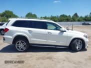 ✅ 2015 Mercedes-Benz GL 550 • VIN: 4JGDF7DE8FA548342 • Лот: 42573049. Опубликован ранее на IAAI с пробегом 103 456 миль. Бесплатный доступ к архиву аукционных продаж из США и подробный отчёт об истории автомобиля на DreamBid. Изображение 13.