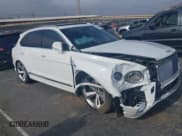 ✅ 2022 Bentley Bentayga V8 • VIN: SJAAM2ZV4NC016521 • Lot: 42154598. Listed on IAAI with 5,985 mi. Free auction sales archive from the USA and detailed vehicle history report at DreamBid. Image 1.