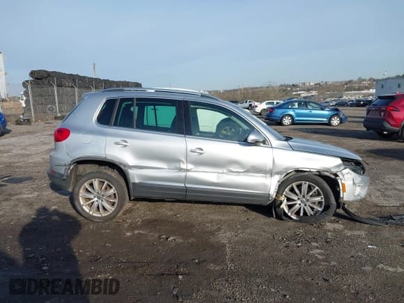 ✅ 2013 Volkswagen Tiguan S • VIN: WVGAV3AX0DW572915 • Лот: 41937763. Опубликован ранее на IAAI с пробегом 65 136 миль. Бесплатный доступ к архиву аукционных продаж из США и подробный отчёт об истории автомобиля на DreamBid. Изображение 13.