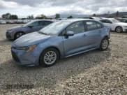 ✅ 2021 Toyota Corolla Hybrid LE • VIN: JTDEAMDE6MJ027851 • Lot: 82621615. Listed on Copart with 128,797 mi. Free auction sales archive from the USA and detailed vehicle history report at DreamBid. Image 1.