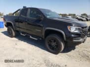 ✅ 2021 Chevrolet Colorado 4WD ZR2 • VIN: 1GCRTEEN5M1128122 • Лот: 80330175. Опубликован ранее на Copart с пробегом 76 144 миль. Бесплатный доступ к архиву аукционных продаж из США и подробный отчёт об истории автомобиля на DreamBid. Изображение 4.