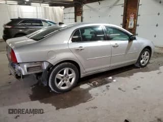 ✅ 2012 Chevrolet Malibu 1LS • VIN: 1G1ZB5E0XCF199477 • Lot: 79210994. Listed on Copart with 143,652 mi. Free auction sales archive from the USA and detailed vehicle history report at DreamBid. Image 3.