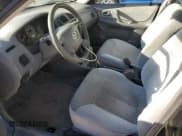 ✅ 2000 Mazda Protege DX • VIN: JM1BJ2220Y0239835 • Lot: 80228864. Wystawiony na Copart z przebiegiem 200 936 mil. Bezpłatny archiwum sprzedaży aukcyjnych z USA i szczegółowy raport historii pojazdu na DreamBid. Zdjęcie 7.