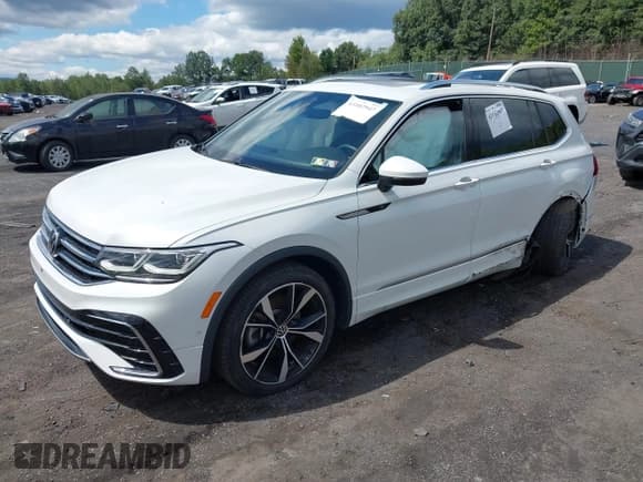 ✅ 2023 Volkswagen Tiguan SEL R-Line • VIN: 3VV4B7AX1PM034909 • Лот: 43102947. Опубликован ранее на IAAI с пробегом 22 043 миль. Бесплатный доступ к архиву аукционных продаж из США и подробный отчёт об истории автомобиля на DreamBid. Изображение 2.