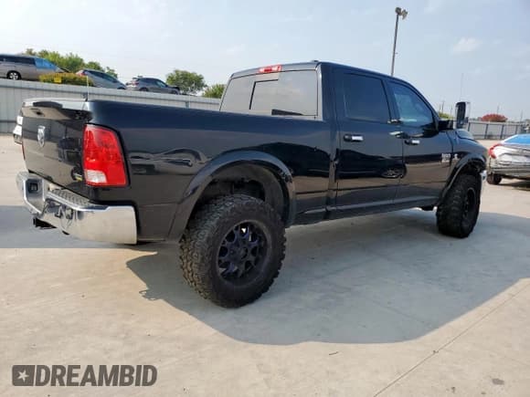 ✅ 2012 Ram 2500 Laramie • VIN: 3C6UD5FL5CG285094 • Lot: 69640555. Listed on Copart with 290,709 mi. Free auction sales archive from the USA and detailed vehicle history report at DreamBid. Image 3.