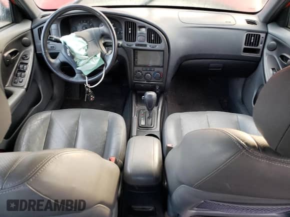 2004 Hyundai Elantra GT z VIN KMHDN56D34U104583, wystawiony jako Copart lot #82441094 z przebiegiem Nie podano mil oraz Szkoda całkowita • Salvage title. Historia ofert i sprzedaży dostępna na DreamBid. Obrazek 8.