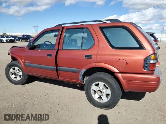 ✅ 1999 Isuzu Rodeo S • VIN: 4S2CM58WXX4318576 • Lot: 44378265. Listed on Copart with 258,981 mi. Free auction sales archive from the USA and detailed vehicle history report at DreamBid. Image 2.