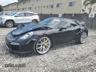 ✅ 2015 Porsche 911 Turbo S • VIN: WP0AD2A94FS166536 • Лот: 71944844. Опубликован ранее на Copart с пробегом 9 222 миль. Бесплатный доступ к архиву аукционных продаж из США и подробный отчёт об истории автомобиля на DreamBid. Изображение 1.