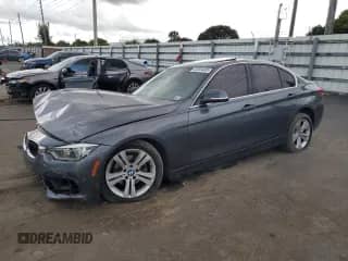 2018 BMW 3 Series 330i xDrive with VIN WBA8D9G57JNU70847, listed as a Copart auction lot 82004405 with 106,746 mi miles and Salvage title. Bid and sale history available at DreamBid. Image 1.