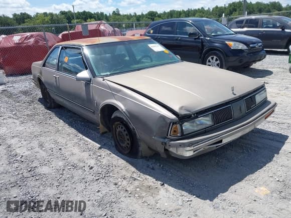 ✅ 1988 Oldsmobile Delta • VIN: 1G3HN14C7JW410839 • Lot: 42691147. Listed on IAAI with 124,911 mi. Free auction sales archive from the USA and detailed vehicle history report at DreamBid. Image 1.