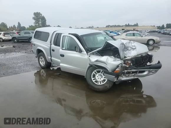 2003 Dodge Dakota Sport z VIN 1D7HG38N83S265442, wystawiony jako Copart lot #84969985 z przebiegiem Nie podano mil oraz Szkoda całkowita • Salvage title. Historia ofert i sprzedaży dostępna na DreamBid. Obrazek 13.