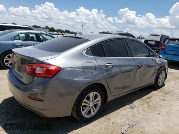 ✅ 2018 Chevrolet Cruze LT • VIN: 1G1BE5SM1J7241431 • Lot: 63491543. Listed on Copart with 64,775 mi. Free auction sales archive from the USA and detailed vehicle history report at DreamBid. Image 3.
