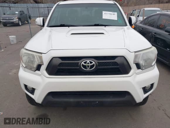 ✅ 2015 Toyota Tacoma • VIN: 3TMLU4EN2FM176180 • Lot: 41778149. Listed on IAAI with 104,059 mi. Free auction sales archive from the USA and detailed vehicle history report at DreamBid. Image 12.