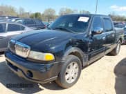 ✅ 2002 Lincoln Blackwood • VIN: 5LTEW05A22KJ02863 • Lot: 41886381. Listed on IAAI with 180,527 mi. Free auction sales archive from the USA and detailed vehicle history report at DreamBid. Image 2.