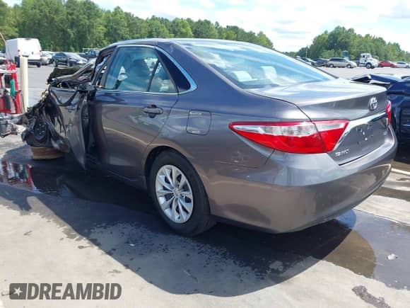 2015 Toyota Camry LE with VIN 4T4BF1FK4FR446399, listed as a IAAI auction lot 43128423 with 82,545 mi miles and . Bid and sale history available at DreamBid. Image 3.