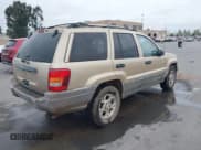 ✅ 1999 Jeep Grand Cherokee Laredo • VIN: 1J4G258S6XC788667 • Lot: 42101081. Wystawiony na IAAI z przebiegiem 255 368 mil. Bezpłatny archiwum sprzedaży aukcyjnych z USA i szczegółowy raport historii pojazdu na DreamBid. Zdjęcie 4.