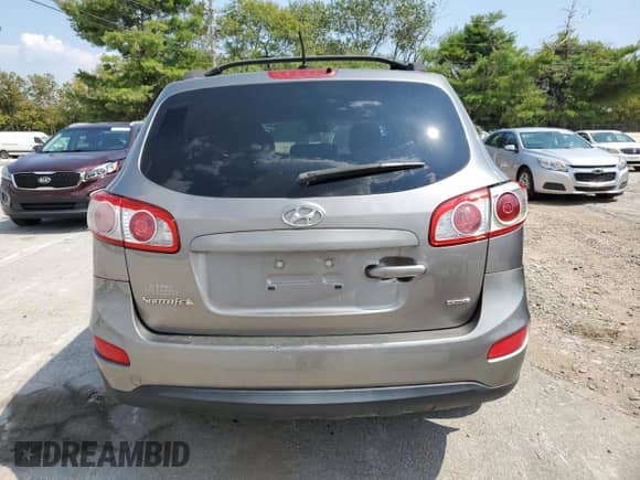 2012 Hyundai Santa Fe GLS z VIN 5XYZGDAB9CG114426, wystawiony jako Copart lot #69819974 z przebiegiem 233 854 mil mil oraz Czysty tytuł • Clean title. Historia ofert i sprzedaży dostępna na DreamBid. Obrazek 6.