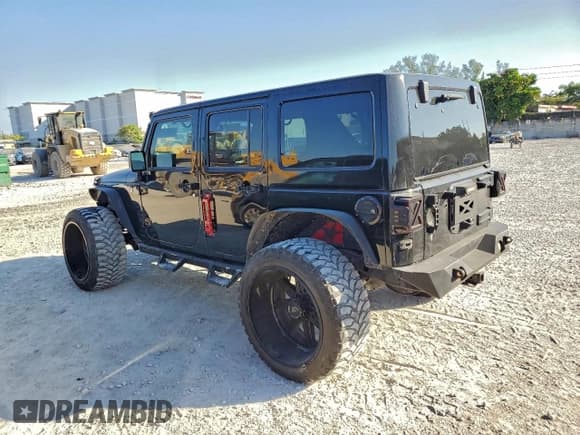 ✅ 2016 Jeep Wrangler Unlimited Sport • VIN: 1C4BJWDG7GL150065 • Lot: 94050955. Listed on Copart with 100,171 mi. Free auction sales archive from the USA and detailed vehicle history report at DreamBid. Image 2.