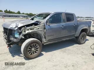 ✅ 2022 Chevrolet Colorado 4WD ZR2 • VIN: 1GCGTEEN1N1314037 • Лот: 64131365. Опубликован ранее на Copart с пробегом 56 009 миль. Бесплатный доступ к архиву аукционных продаж из США и подробный отчёт об истории автомобиля на DreamBid. Изображение 1.