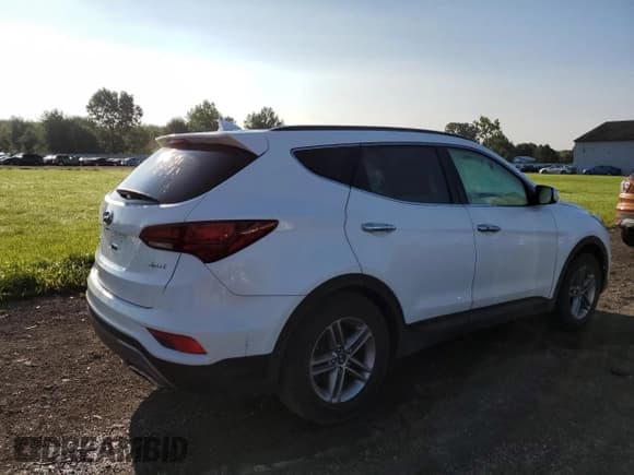✅ 2018 Hyundai Santa Fe 2.4L • VIN: 5XYZU3LB8JG567272 • Лот: 65879393. Опубликован ранее на Copart с пробегом 56 956 миль. Бесплатный доступ к архиву аукционных продаж из США и подробный отчёт об истории автомобиля на DreamBid. Изображение 3.