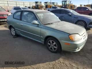 2003 Hyundai Accent GL with VIN KMHCG35CX3U242848, listed as a Copart auction lot 86558394 with 56,248 mi miles and Salvage title. Bid and sale history available at DreamBid. Image 4.
