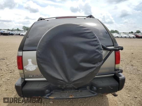 2004 Chevrolet Blazer LS z VIN 1GNCT18X54K104416, wystawiony jako Copart lot #64748575 z przebiegiem Nie podano mil oraz Szkoda całkowita • Salvage title. Historia ofert i sprzedaży dostępna na DreamBid. Obrazek 6.