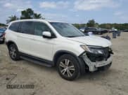 ✅ 2017 Honda Pilot EX-L • VIN: 5FNYF6H77HB031118 • Lot: 81370035. Listed on Copart with 166,144 mi. Free auction sales archive from the USA and detailed vehicle history report at DreamBid. Image 4.