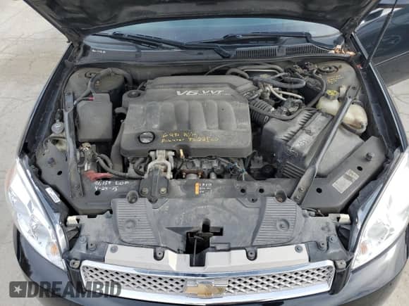 2014 Chevrolet Impala LT z VIN 2G1WB5E32E1181918, wystawiony jako Copart lot #90488815 z przebiegiem 104 894 mil mil oraz Szkoda całkowita • Salvage title. Historia ofert i sprzedaży dostępna na DreamBid. Obrazek 11.