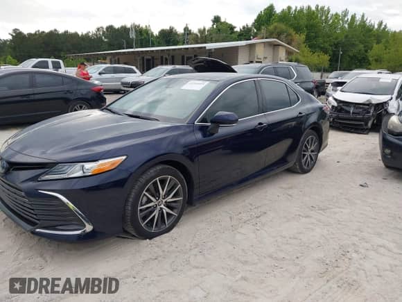 2022 Toyota Camry Hybrid XLE with VIN 4T1F31AK4NU591517, listed as a IAAI auction lot 42216959 with 36,048 mi miles and . Bid and sale history available at DreamBid. Image 18.